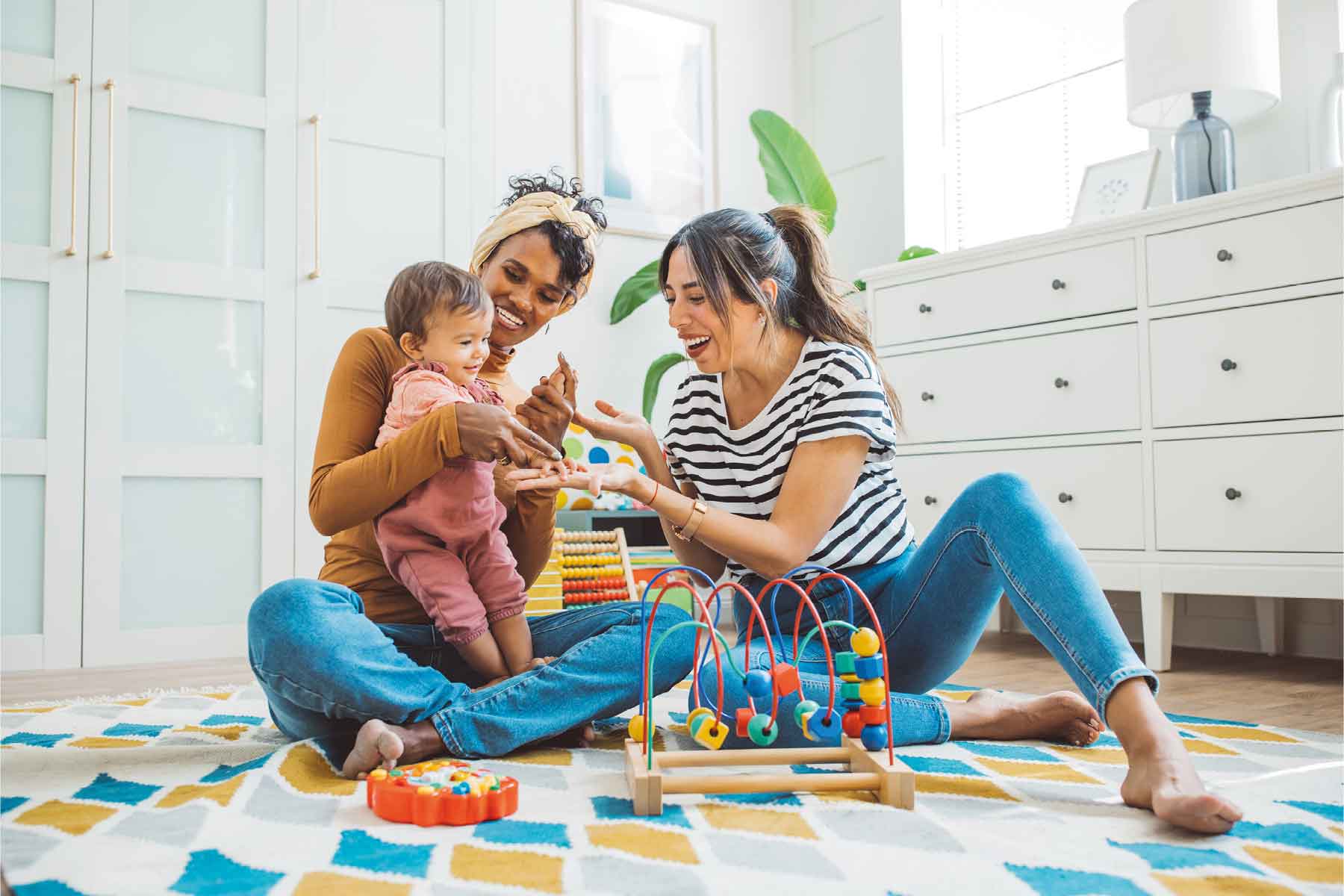 A couple sat down playing with their child